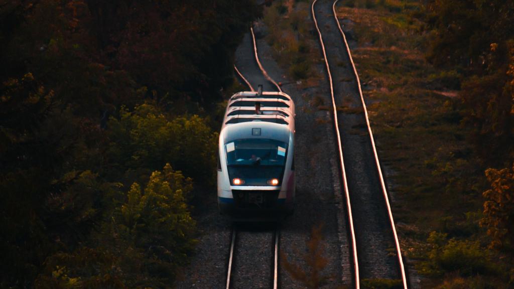 A train on rails during sunset