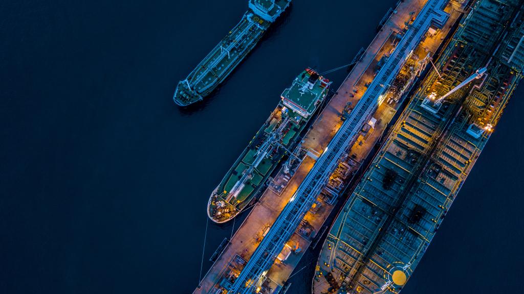Aerial view of tanker vessel docks at a port
