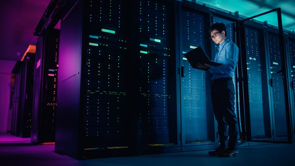 IT technician running maintenance programme in data center
