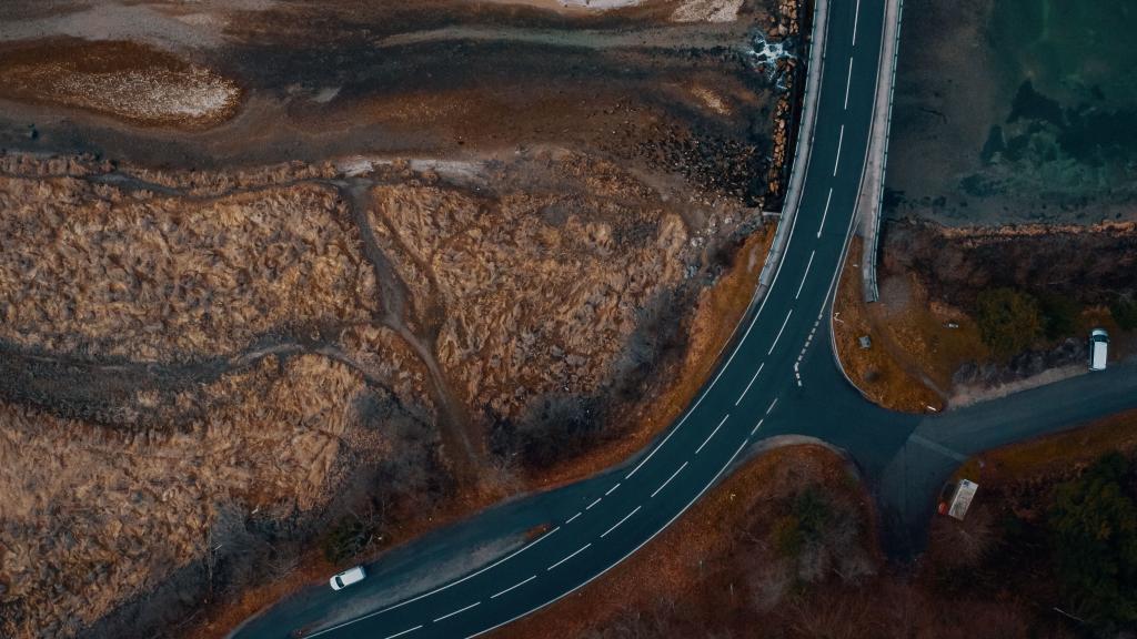 Vertical aerial photo of a road through a reservoir