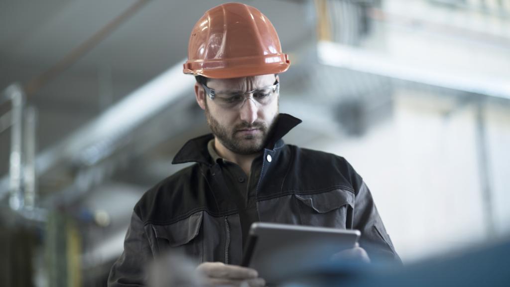 Young technician working on a tablet