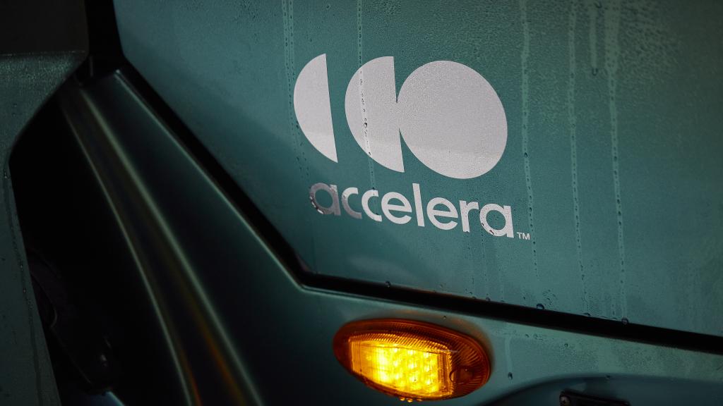 Accelera logo in white on the door of a zero-emission vehicle