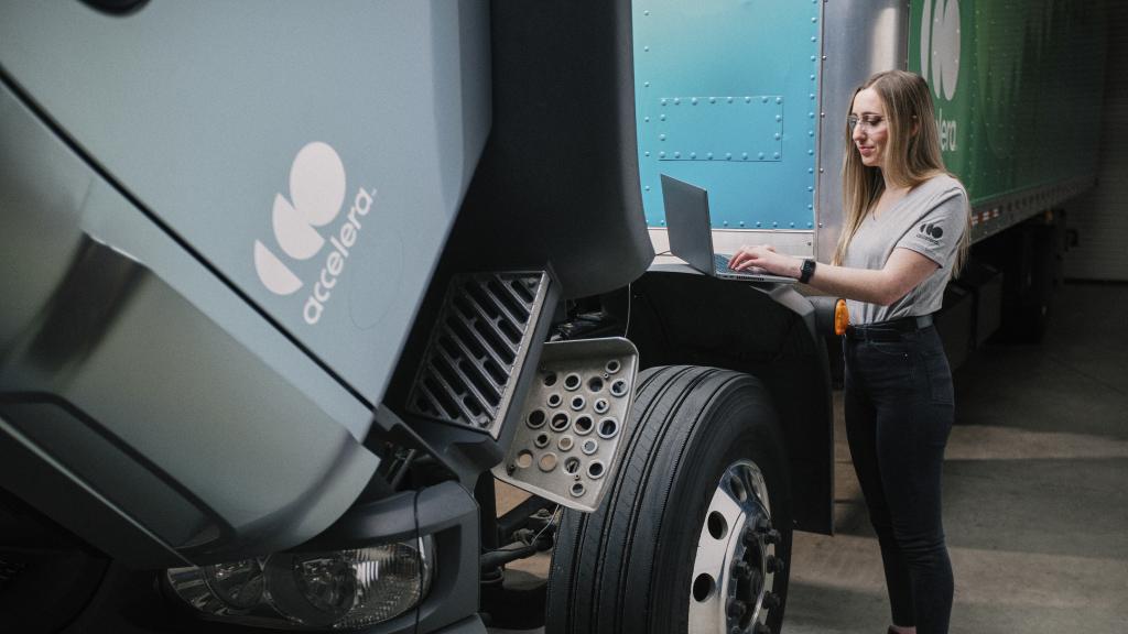 Female engineer working under the hood of an Accelera zero-emission truck