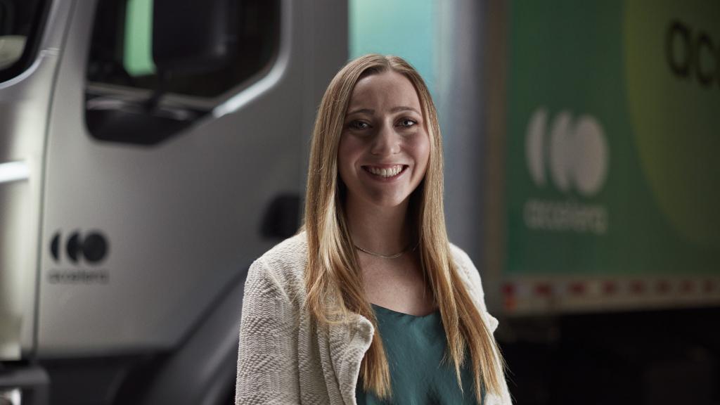 Female engineer standing in front of an Accelera zero-emission truck