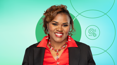 Yolanda Durfield wearing a red collard shirt with a black blazer