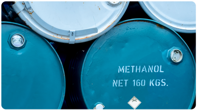 Blue methanol barrels stacked on top of one another