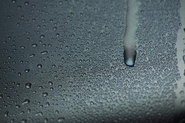 Water condensation dripping down truck door