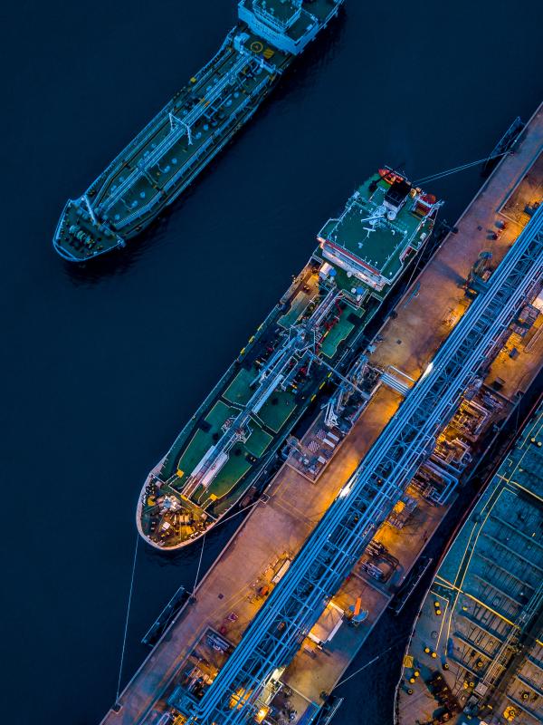 Aerial view of tanker vessel docks at a port