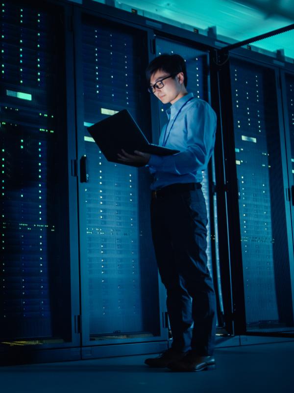 IT technician running maintenance programme in data center