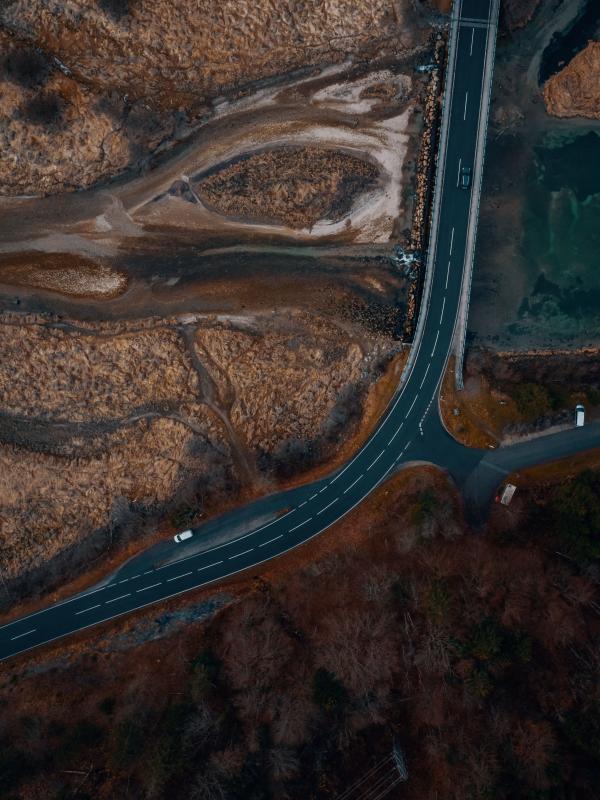 Vertical aerial photo of a road through a reservoir 