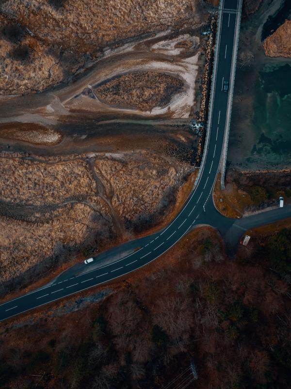 Vertical aerial photo of a road through a reservoir