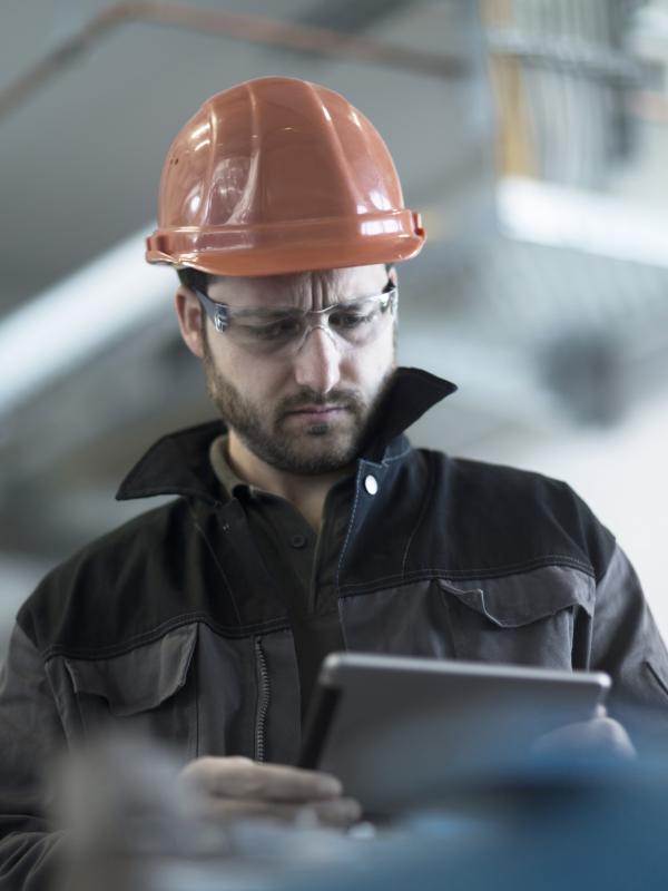 Young technician working on a tablet