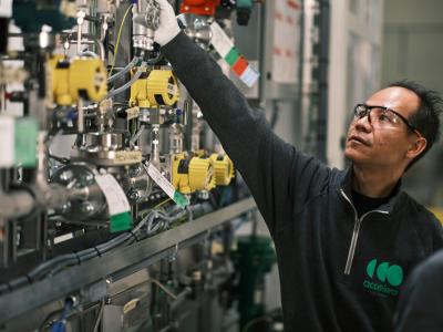 Man inspecting electrolyzer parts