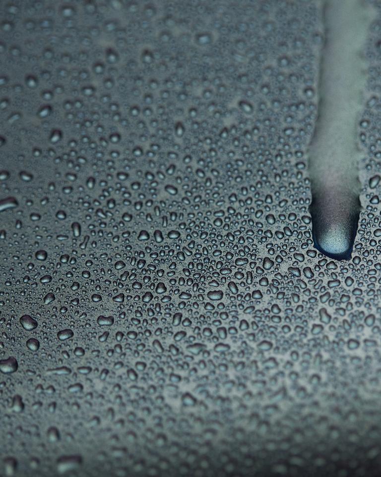 Water condensation dripping down truck door