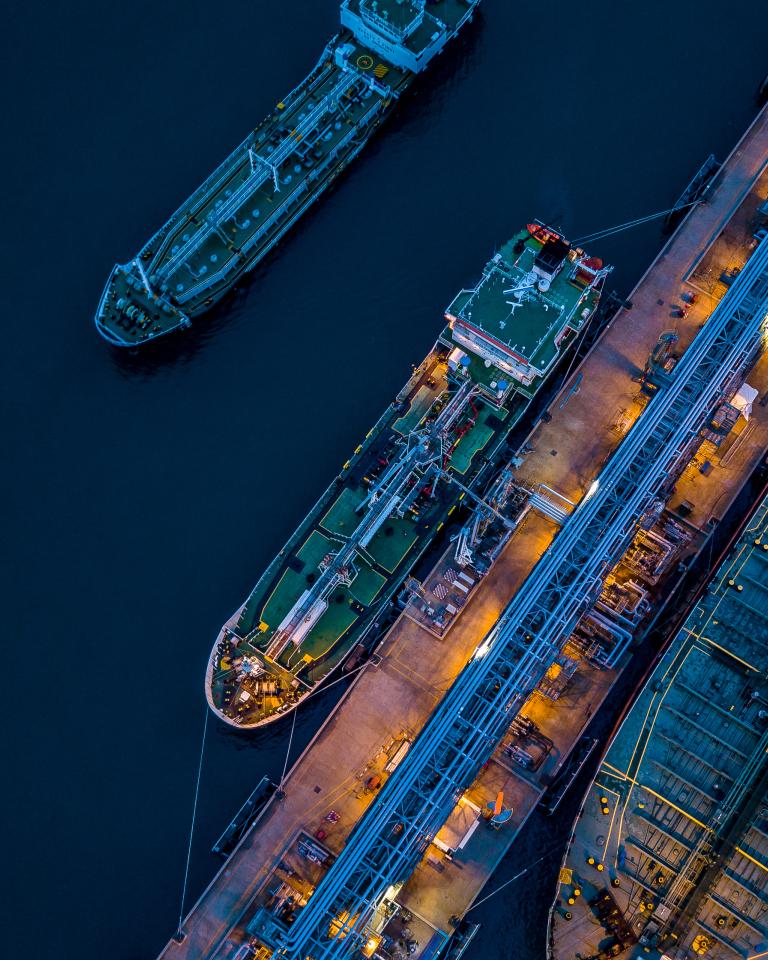 Aerial view of tanker vessel docks at a port