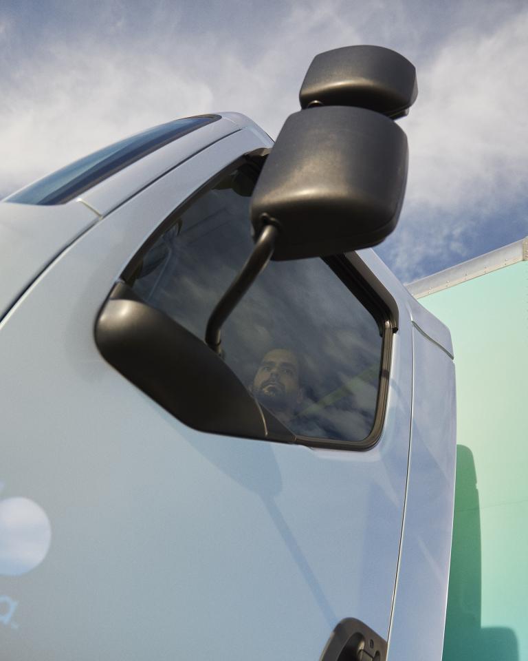 An upward shot of the side door on an Accelera electric truck