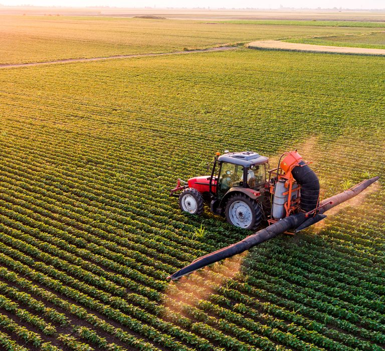 Red tractor in a green field