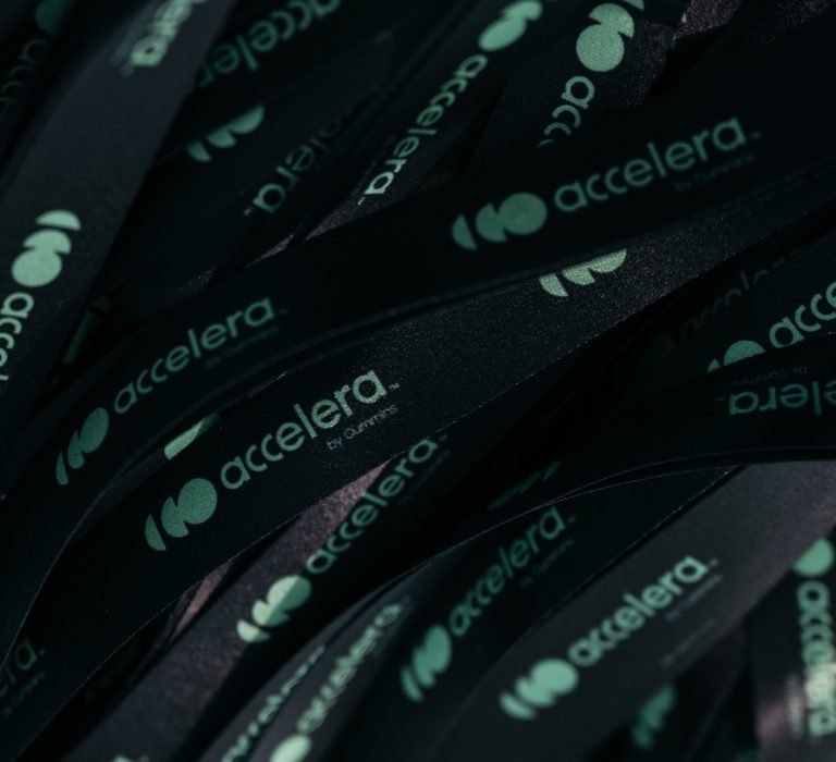 Black lanyards with green logo printed on them