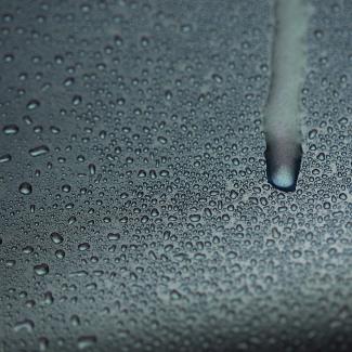 Water condensation dripping down truck door